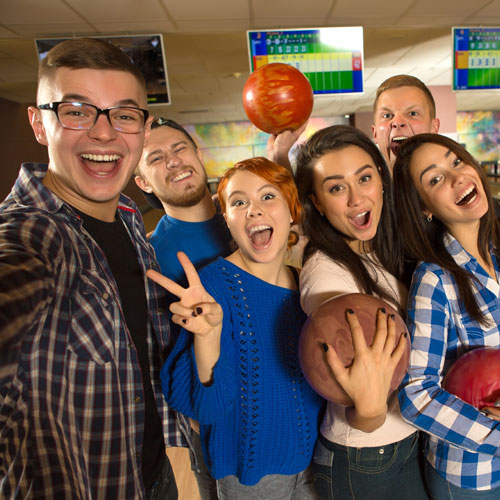 young adults ready to bowl